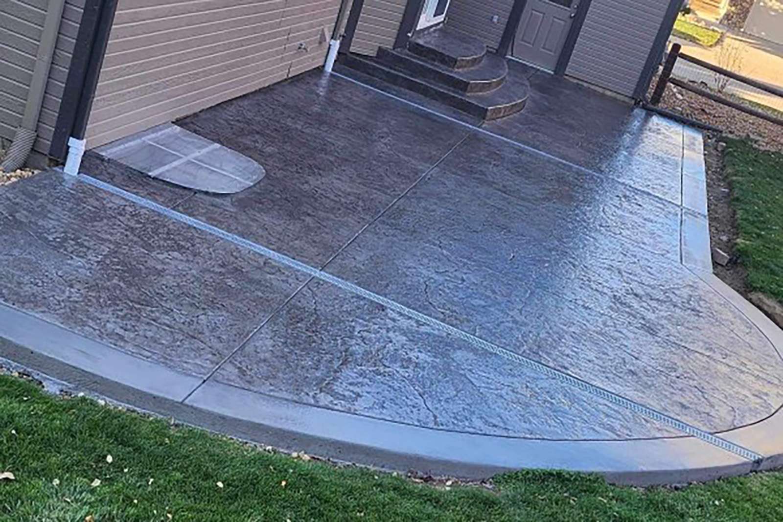 ECB Concrete Residential Stamped Concrete Patio with Curved Edges and Steps Stamped Concrete